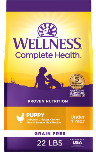 Wellness Complete Health Puppy food in a gold and purple package. Our top pick for Best Dry Dog Food for Golden Retrievers puppies