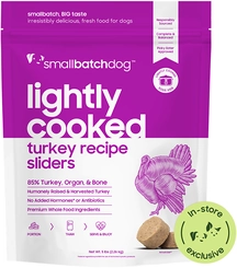 Smallbatch lightly cooked turkey sliders for dogs in purple-and-white packaging with turkey artwork, food pieces and a green badge.
