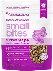 Smallbatch Turkey Small Bites freeze-dried raw dog food in a purple and white bag with bite-sized pieces visible through a clear window.